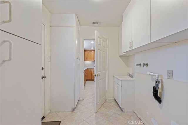 8038 Cyclamen Way, Buena Park, CA 90620 - laundry area with cabinet space, hookup for a washing machine, and light tile patterned flooring
