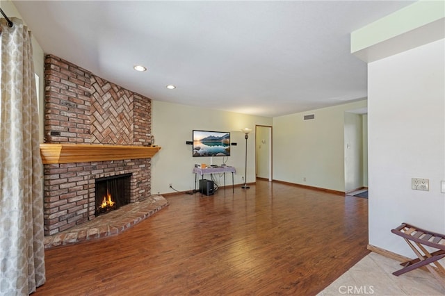 8038 Cyclamen Way, Buena Park, CA 90620 - unfurnished living room with a brick fireplace, recessed lighting, and wood finished floors