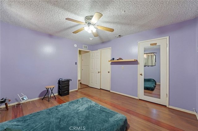 8038 Cyclamen Way, Buena Park, CA 90620 - bedroom featuring wood finished floors, a textured ceiling, and ceiling fan