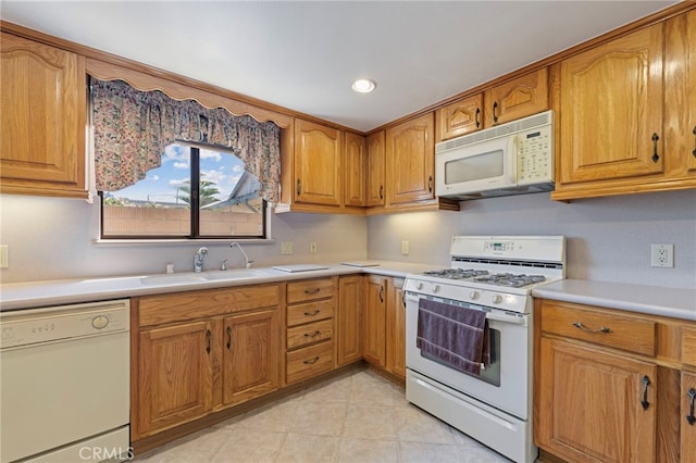 8038 Cyclamen Way, Buena Park, CA 90620 - kitchen featuring white appliances, light countertops, brown cabinetry, light tile patterned floors, and recessed lighting