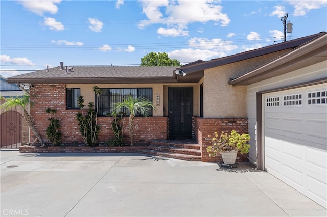 8038 Cyclamen Way, Buena Park, CA 90620 - view of front of home with brick siding, stucco siding, driveway, and an attached garage