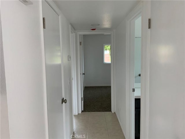 4839 Sanchez Dr, Guadalupe, CA 93434 - hallway featuring light tile patterned floors and light colored carpet