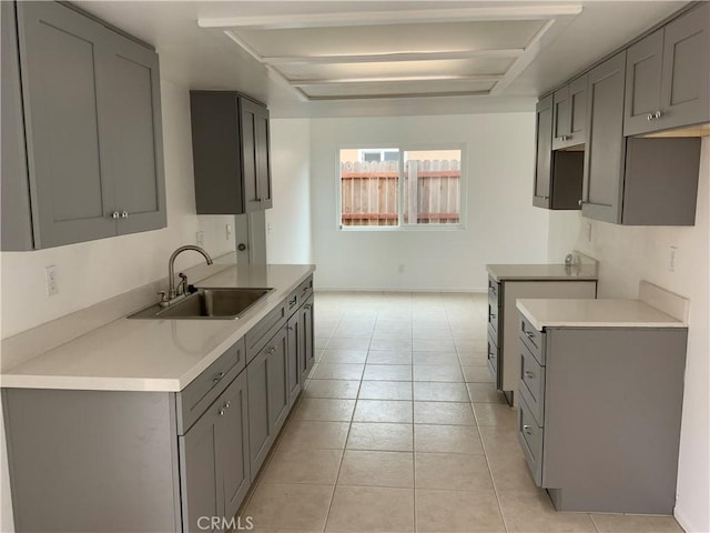 4839 Sanchez Dr, Guadalupe, CA 93434 - kitchen with gray cabinetry, light tile patterned floors, and light countertops