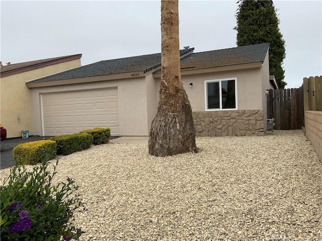 4839 Sanchez Dr, Guadalupe, CA 93434 - view of property exterior featuring a garage and stucco siding