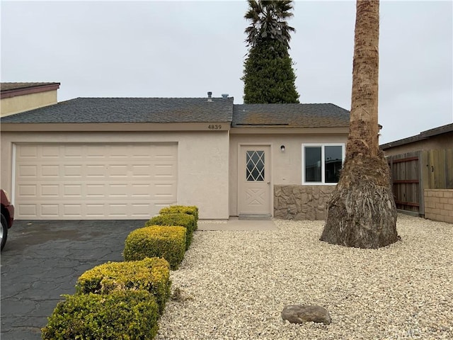 4839 Sanchez Dr, Guadalupe, CA 93434 - view of front facade featuring driveway, an attached garage, and stucco siding