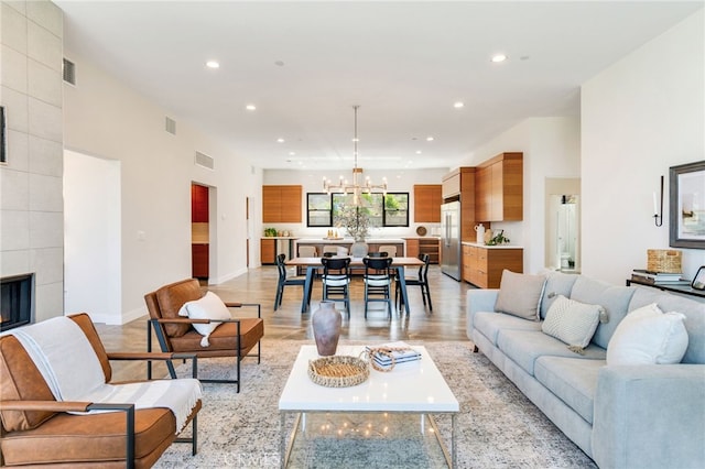 1922 Edgefair Ln, Redlands, CA 92373 - living room featuring a chandelier, recessed lighting, light wood-style floors, and a fireplace