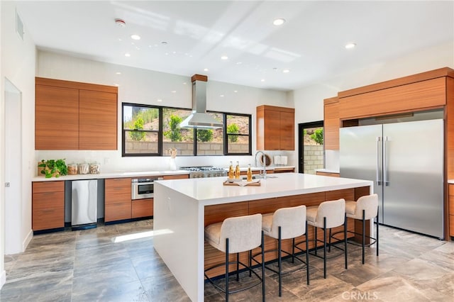 1922 Edgefair Ln, Redlands, CA 92373 - kitchen with appliances with stainless steel finishes, island exhaust hood, modern cabinets, brown cabinets, and recessed lighting