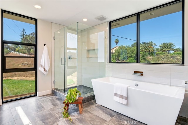 1922 Edgefair Ln, Redlands, CA 92373 - bathroom featuring a soaking tub, a shower stall, recessed lighting, and tile walls