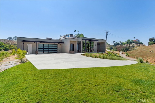 1922 Edgefair Ln, Redlands, CA 92373 - modern home with driveway, a front lawn, and a garage