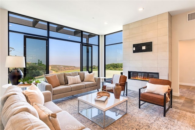1922 Edgefair Ln, Redlands, CA 92373 - living room featuring a tiled fireplace, a wall of windows, and recessed lighting