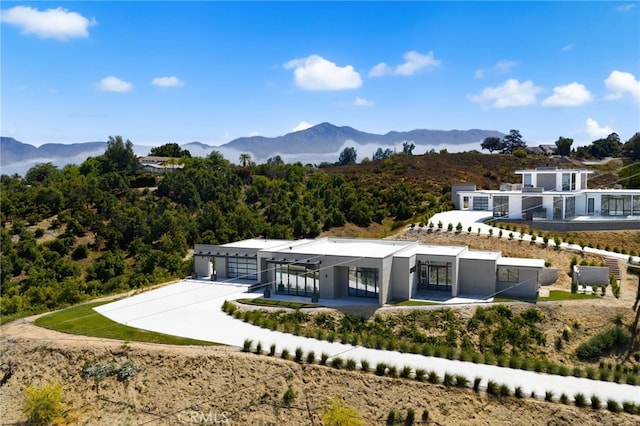 1922 Edgefair Ln, Redlands, CA 92373 - rear view of house with a mountain view, a garage, and concrete driveway
