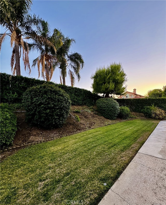 6159 Fleetwood Ln, Chino Hills, CA 91709 - yard at dusk with a lawn