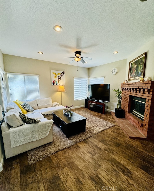 6159 Fleetwood Ln, Chino Hills, CA 91709 - living room with wood finished floors, ceiling fan, a fireplace, and a textured ceiling