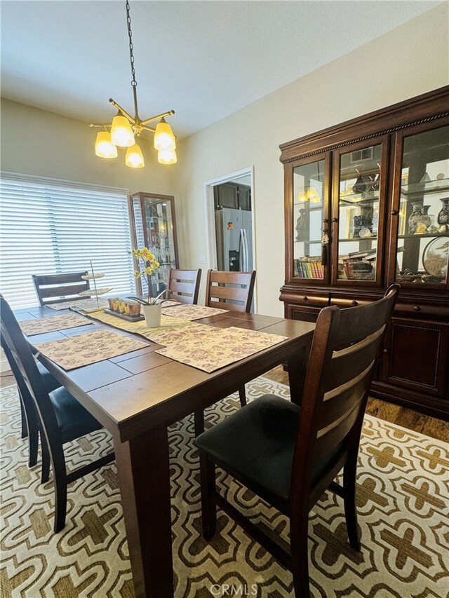 6159 Fleetwood Ln, Chino Hills, CA 91709 - dining space with a chandelier and light wood-style floors