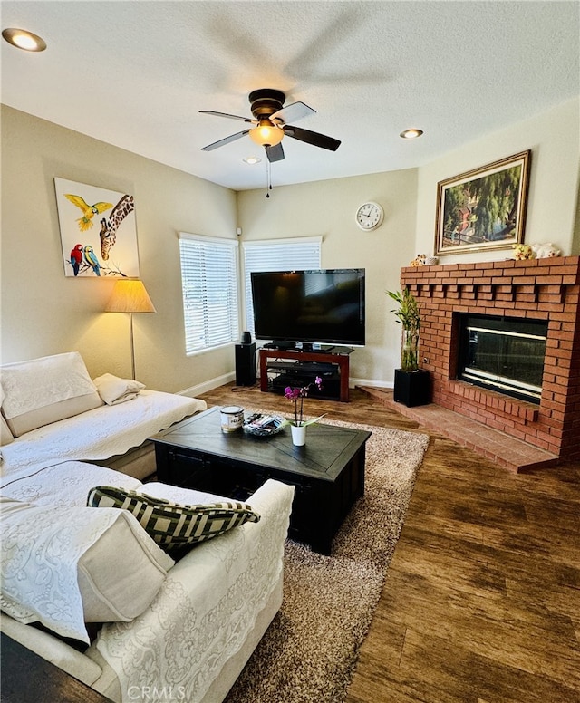 6159 Fleetwood Ln, Chino Hills, CA 91709 - living room with ceiling fan, wood finished floors, a brick fireplace, a textured ceiling, and recessed lighting