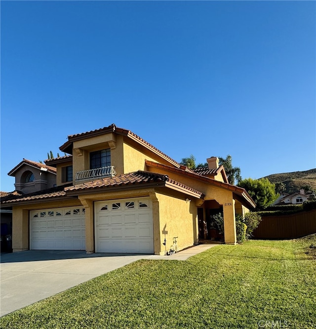 6159 Fleetwood Ln, Chino Hills, CA 91709 - mediterranean / spanish home with stucco siding, concrete driveway, a garage, and a tiled roof