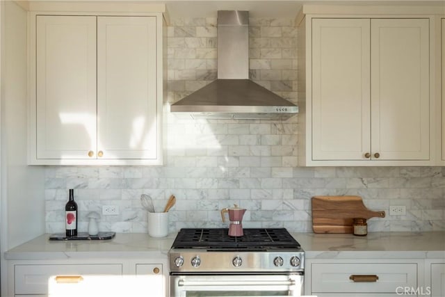 1830 N Alvarado St Unit 14, Los Angeles, CA 90026 - kitchen with gas range, wall chimney range hood, decorative backsplash, and white cabinetry