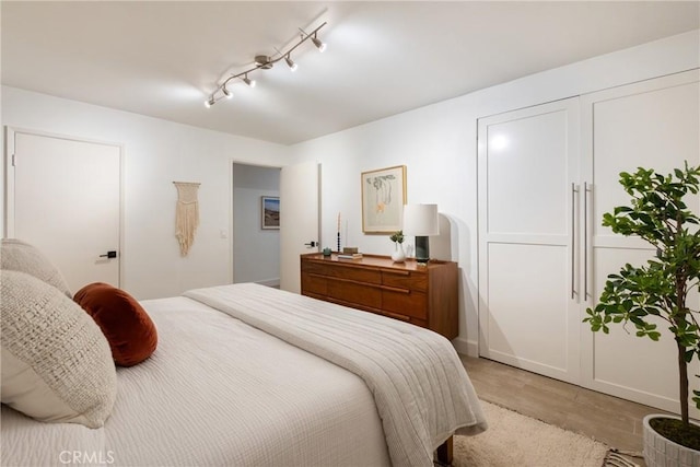 1830 N Alvarado St Unit 14, Los Angeles, CA 90026 - bedroom with light wood finished floors and track lighting