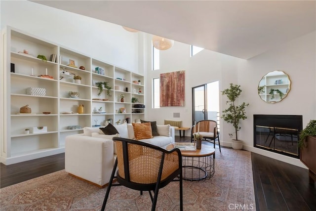 1830 N Alvarado St Unit 14, Los Angeles, CA 90026 - living room with wood-type flooring, a glass covered fireplace, and a high ceiling