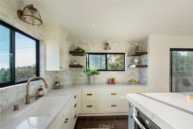 1830 N Alvarado St Unit 14, Los Angeles, CA 90026 - kitchen with open shelves, tasteful backsplash, light stone countertops, and white cabinets