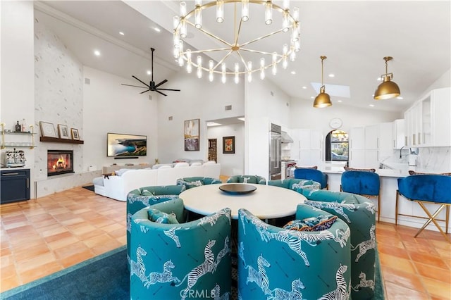 810 E Dalton Ave, Glendora, CA 91741 - dining area featuring high vaulted ceiling, a chandelier, a large fireplace, a ceiling fan, and light tile patterned floors