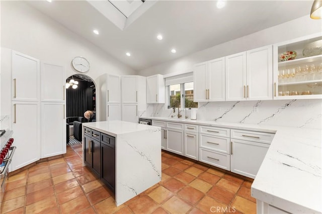 810 E Dalton Ave, Glendora, CA 91741 - kitchen featuring decorative backsplash, white cabinets, lofted ceiling, light stone counters, and recessed lighting