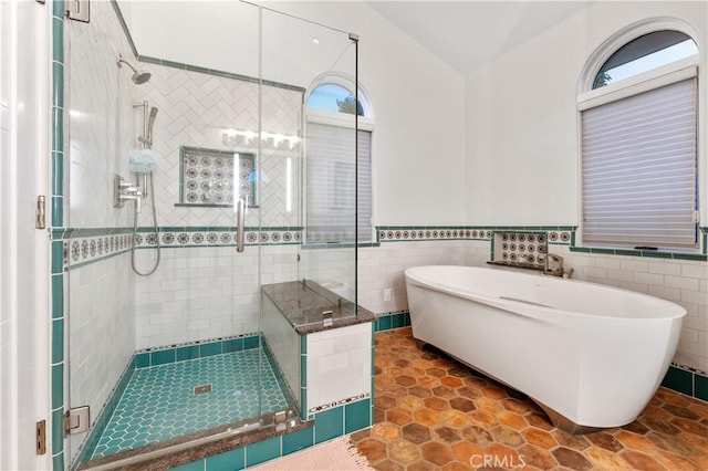 810 E Dalton Ave, Glendora, CA 91741 - full bathroom with a shower stall, a freestanding tub, tile walls, and a wainscoted wall