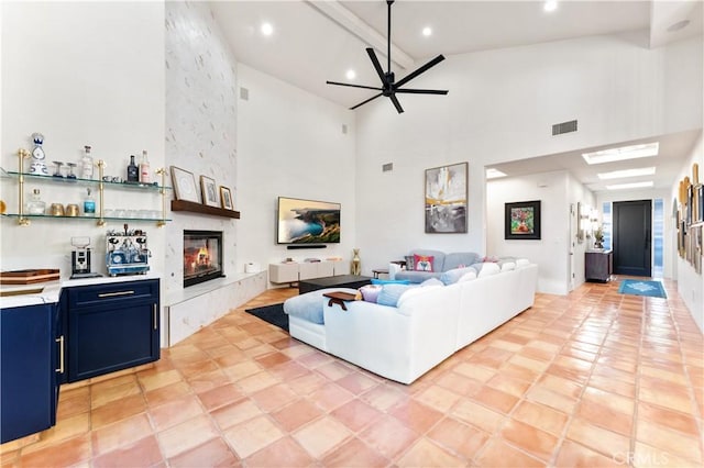 810 E Dalton Ave, Glendora, CA 91741 - living area featuring high vaulted ceiling, a fireplace, ceiling fan, recessed lighting, and beamed ceiling