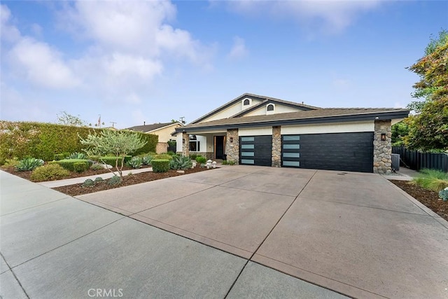810 E Dalton Ave, Glendora, CA 91741 - view of front of house featuring driveway, a garage, and stone siding