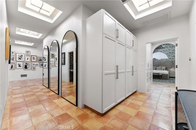810 E Dalton Ave, Glendora, CA 91741 - hallway featuring a skylight and light tile patterned floors
