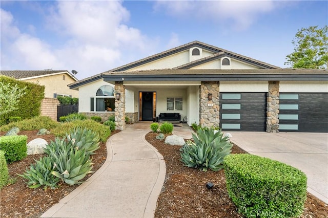 810 E Dalton Ave, Glendora, CA 91741 - view of front facade featuring stucco siding, concrete driveway, a garage, and stone siding