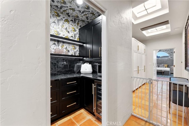 810 E Dalton Ave, Glendora, CA 91741 - indoor dry bar featuring wine cooler, light tile patterned flooring, tasteful backsplash, and a textured wall