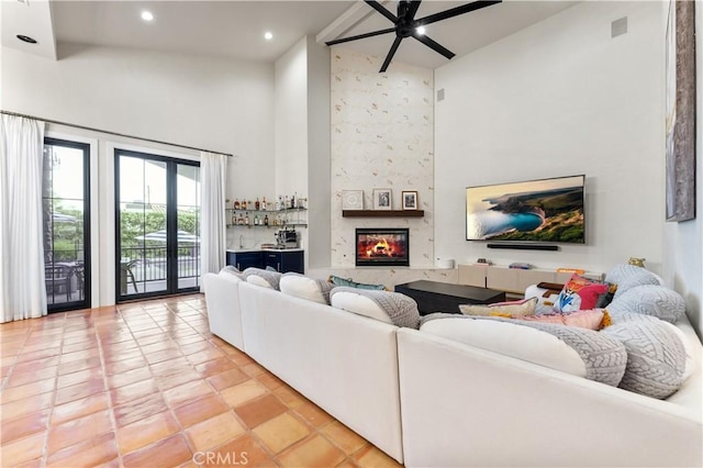 810 E Dalton Ave, Glendora, CA 91741 - living room with a high ceiling, ceiling fan, recessed lighting, light tile patterned floors, and a fireplace