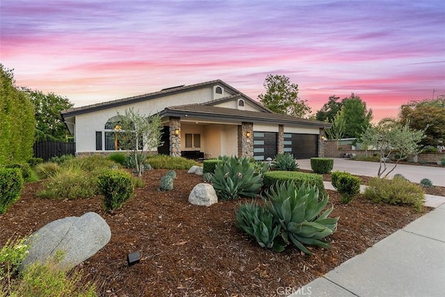 810 E Dalton Ave, Glendora, CA 91741 - view of front of house with stone siding, stucco siding, driveway, and a garage