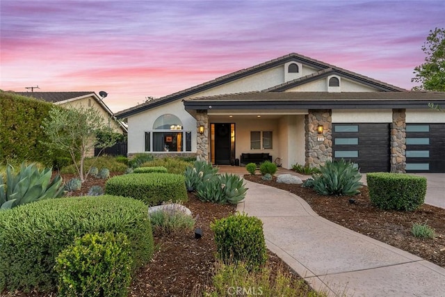 810 E Dalton Ave, Glendora, CA 91741 - view of front of property featuring stucco siding, concrete driveway, stone siding, and an attached garage