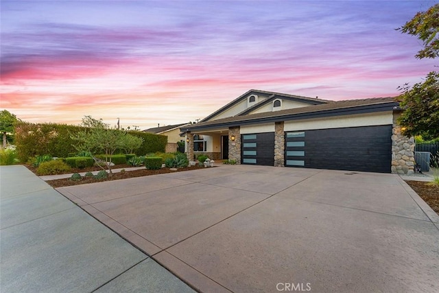 810 E Dalton Ave, Glendora, CA 91741 - view of front of home with concrete driveway, a garage, stone siding, and stucco siding
