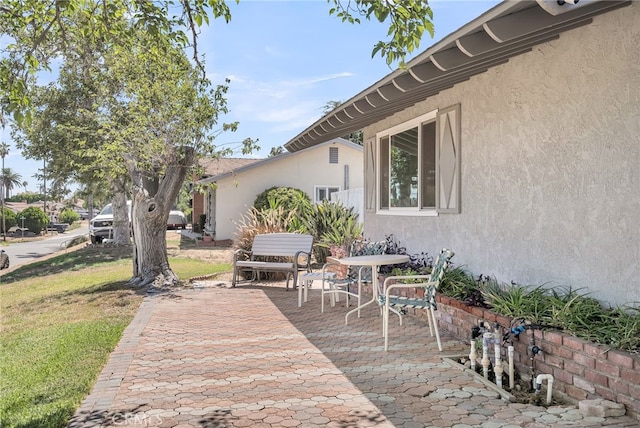 7219 Font Ave, Jurupa Valley, CA 92509 - wooden deck featuring a patio and a lawn