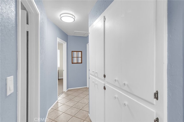 7219 Font Ave, Jurupa Valley, CA 92509 - hallway featuring light tile patterned floors and baseboards