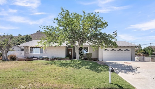 7219 Font Ave, Jurupa Valley, CA 92509 - view of front of property featuring concrete driveway, an attached garage, and stucco siding