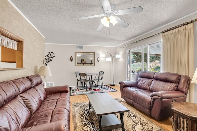 7219 Font Ave, Jurupa Valley, CA 92509 - living area with a textured ceiling, light wood-type flooring, a ceiling fan, and crown molding