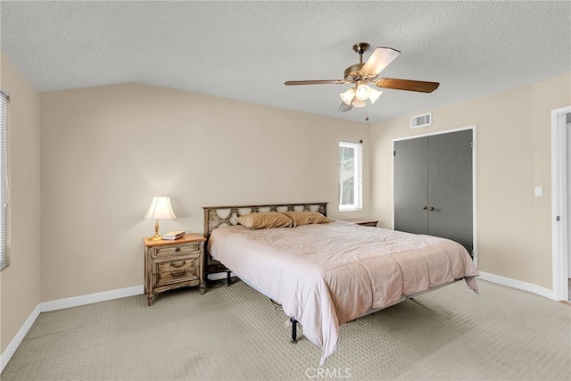 7219 Font Ave, Jurupa Valley, CA 92509 - bedroom with light colored carpet, a closet, a ceiling fan, and a textured ceiling
