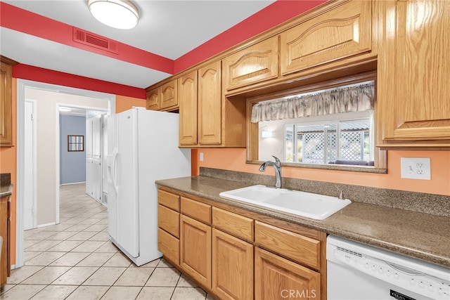 7219 Font Ave, Jurupa Valley, CA 92509 - kitchen with white appliances, light tile patterned floors, and dark countertops