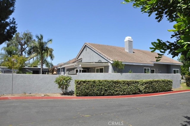 3629 Puente Ave, Baldwin Park, CA 91706 - view of front of property featuring a chimney, stucco siding, and a tile roof