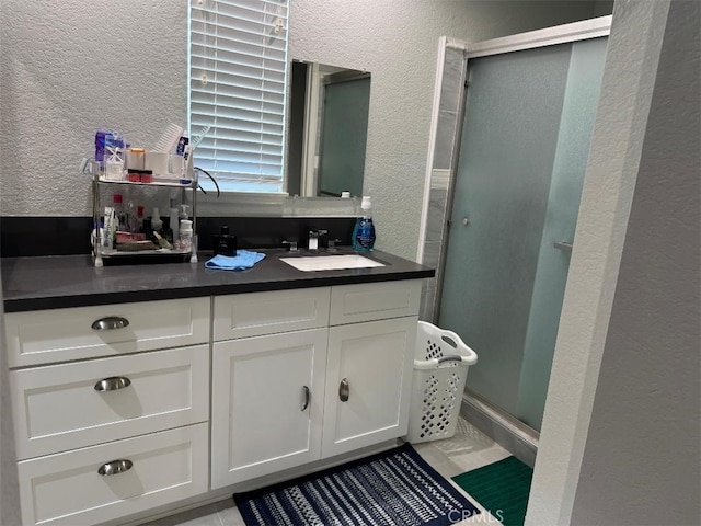 3629 Puente Ave, Baldwin Park, CA 91706 - full bathroom with a textured wall, a stall shower, and vanity