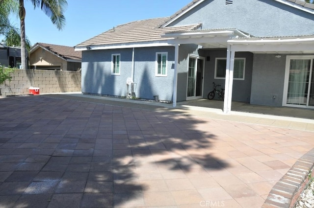 3629 Puente Ave, Baldwin Park, CA 91706 - rear view of house featuring stucco siding, a patio, and a tile roof