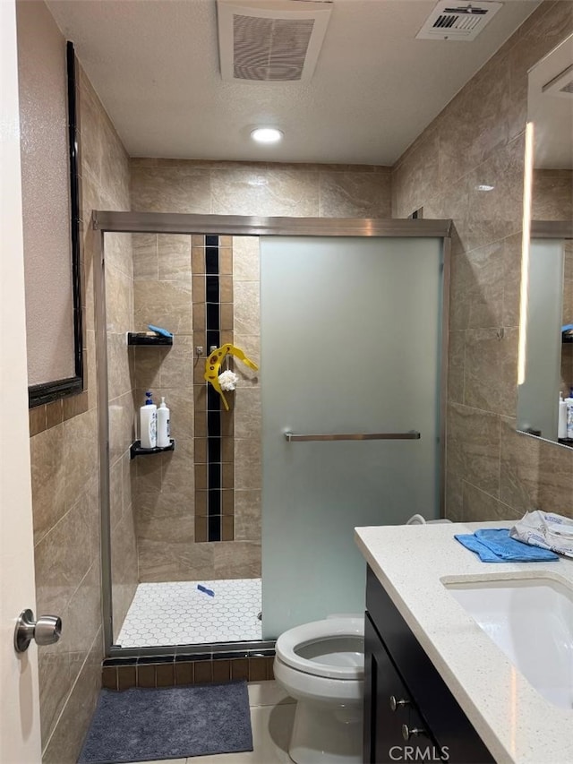 3629 Puente Ave, Baldwin Park, CA 91706 - full bath featuring vanity, tile walls, a shower stall, and tile patterned flooring