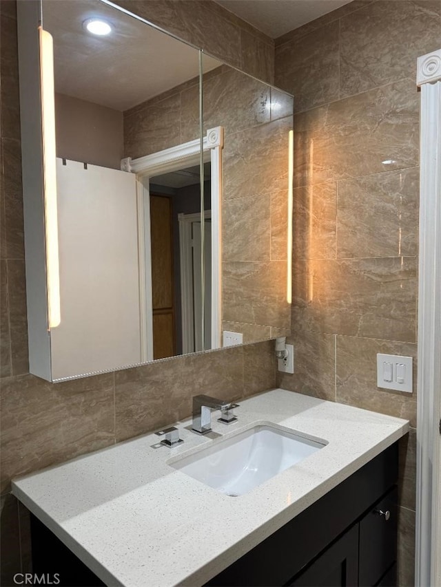 3629 Puente Ave, Baldwin Park, CA 91706 - bathroom with tile walls, vanity, and backsplash