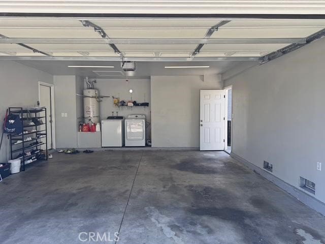3629 Puente Ave, Baldwin Park, CA 91706 - garage featuring washer and dryer, water heater, and a garage door opener