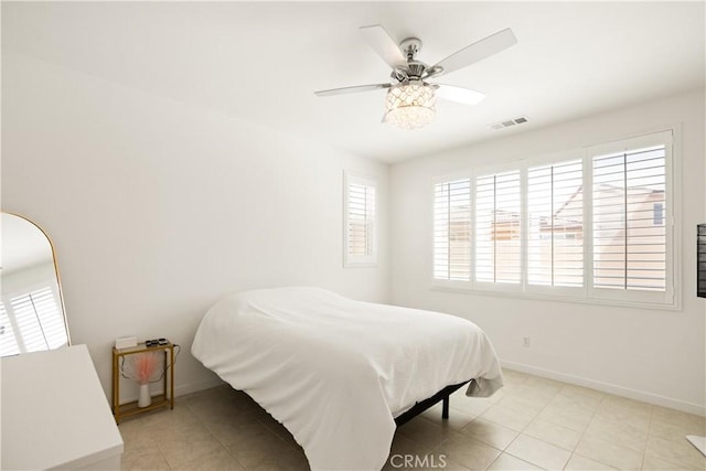 11624 Sky Pointe Dr, Desert Hot Springs, CA 92240 - tiled bedroom featuring baseboards and a ceiling fan