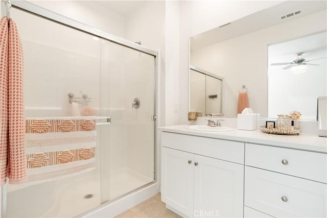 11624 Sky Pointe Dr, Desert Hot Springs, CA 92240 - bathroom with a stall shower, vanity, a ceiling fan, and tile patterned floors